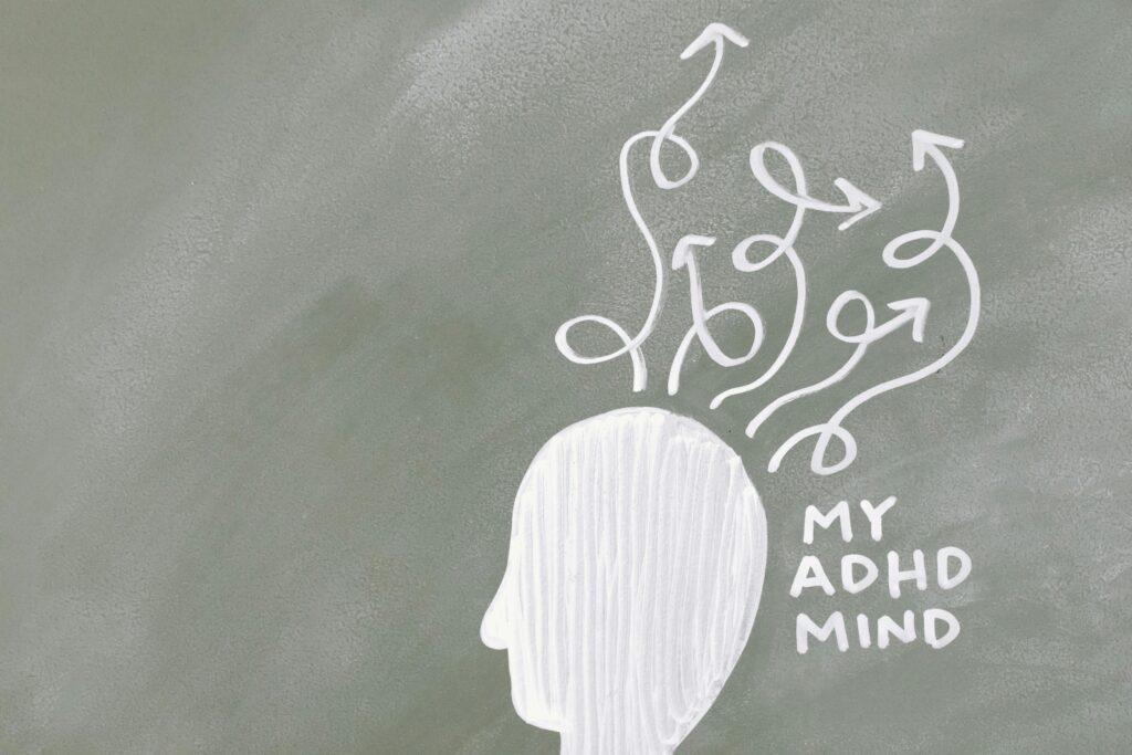 Creative depiction of the ADHD mind with chalk arrows on a green board.